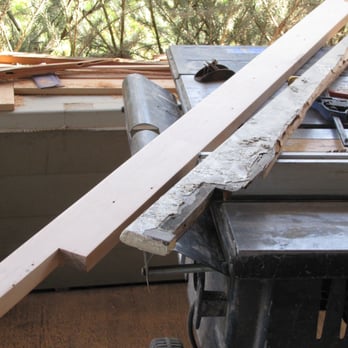 Riverside Restorative - a pile of wood on a work bench - General Contractors Near Me Riverside Restorative - a pile of wood on a work bench - General Contractors Near Me