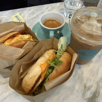 49th Parallel Coffee - The Doug sandwich (left), the Avo sandwich (right), espresso, and maple sea salt shaken espresso - Coffee & Tea Near Me - Vancouver, British Columbia 49th Parallel Coffee - The Doug sandwich (left), the Avo sandwich (right), espresso, and maple sea salt shaken espresso - Coffee & Tea Near Me - Vancouver, British Columbia