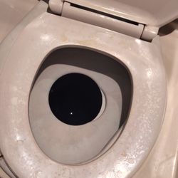 Greyhound Bus Lines - Bathroom on the Greyhound bus, covered in piss