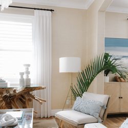 Beach Haus Interiors - Bringing outdoors indoors with a capiz shell light fixture, seagrass wallpaper, & palm fronds to liven up this conversation space! Venice, F