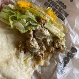 a burrito with lettuce and cheese