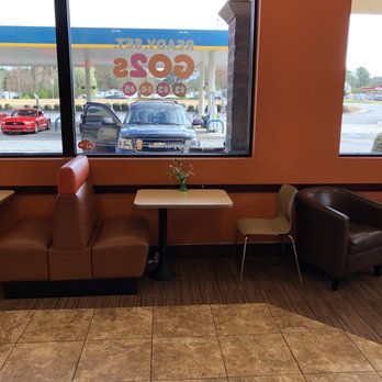 Dunkin' -  two chairs and a table in front of a window - Coffee & Tea Near Me - Rex, Georgia