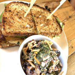 Stone Soup - Roasted chicken, bacon, lettuce, Fried green Tomatoes pimento cheese, garlic, aïoli on a toasted multigrain bread with broccoli salad