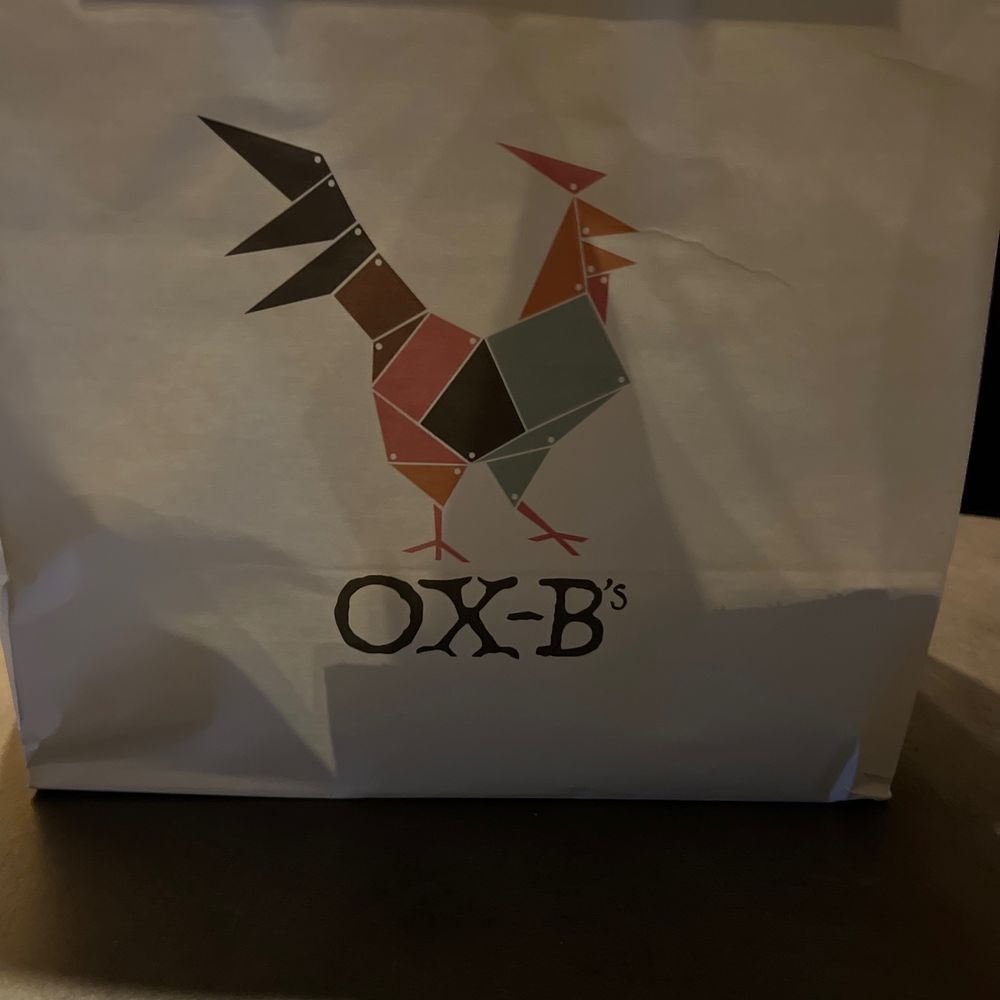 Cute takeout bag. Wings were packaged in a box, cornbread in a bag, sides in a cup.