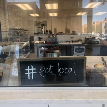 Sarnies - a window with a sign that says eat local - Delis Near Me - Toledo, Ohio Sarnies - a window with a sign that says eat local - Delis Near Me - Toledo, Ohio