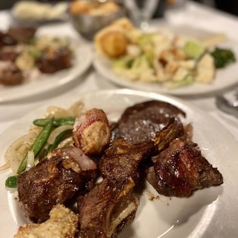 Estampa Gaucha - a plate of meat and vegetables - Steakhouses Near Me - Melbourne, Florida