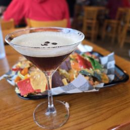 Nachos and espresso martini. Nachos and espresso martini.