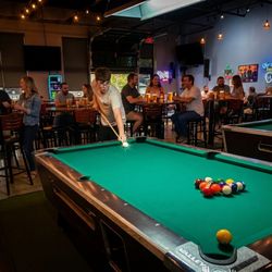 Pool, darts, and gaming at Tallboyz Garage.