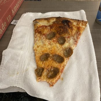 Benny’s On The Ocean - One slice on a hotel hand towel folded for size comparison (slice) - Pizza Near Me - Virginia Beach, Virginia Benny’s On The Ocean - One slice on a hotel hand towel folded for size comparison (slice) - Pizza Near Me - Virginia Beach, Virginia