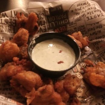 Dew Chilli Parlor - a basket of fried shrimp with dipping sauce - Pubs Near Me - Springfield, Illinois