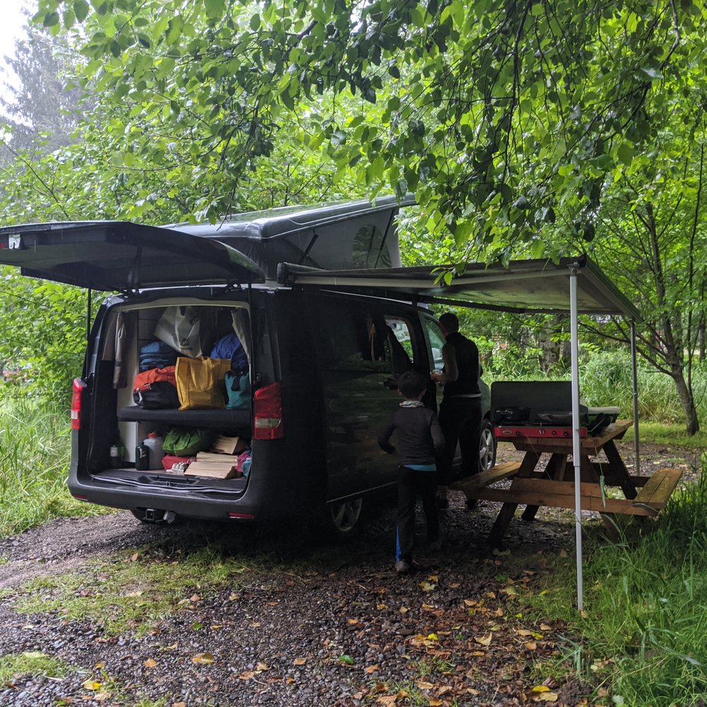 Peace Vans - Fully utilizing the awning during a day of rain - Auto Repair Near Me - Seattle, Washington Peace Vans - Fully utilizing the awning during a day of rain - Auto Repair Near Me - Seattle, Washington
