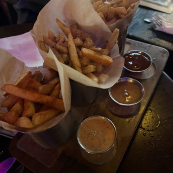 Hennessey's Tavern - With all of the food we ordered I o Ly captured the French Fry Sampler! - Irish Near Me - Hermosa Beach, California Hennessey's Tavern - With all of the food we ordered I o Ly captured the French Fry Sampler! - Irish Near Me - Hermosa Beach, California