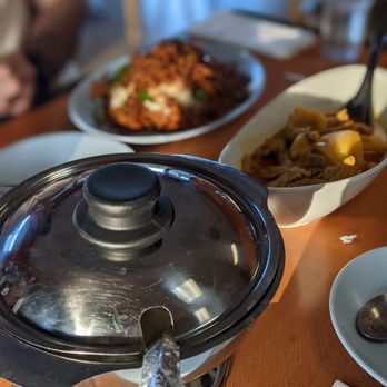 Treasure Pot Thai Restaurant - a pot of food on a table - Thai Near Me - Paramount, California Treasure Pot Thai Restaurant - a pot of food on a table - Thai Near Me - Paramount, California