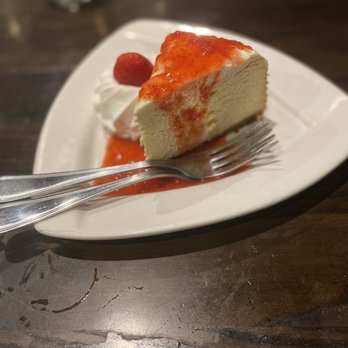 Local Goat - NY Cheesecake with Strawberry Coulis - New American Near Me - Pigeon Forge, Tennessee Local Goat - NY Cheesecake with Strawberry Coulis - New American Near Me - Pigeon Forge, Tennessee