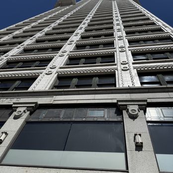 Smith Tower Observatory Bar - Looking up at the terracotta facade. - Cocktail Bars Near Me - Seattle, Washington Smith Tower Observatory Bar - Looking up at the terracotta facade. - Cocktail Bars Near Me - Seattle, Washington