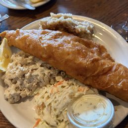 Beer battered fish, macaroni salad, German potato salad, coleslaw, and tartar sauce. Beer battered fish, macaroni salad, German potato salad, coleslaw, and tartar sauce.