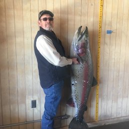 My daddy in the clubhouse by the big trout.