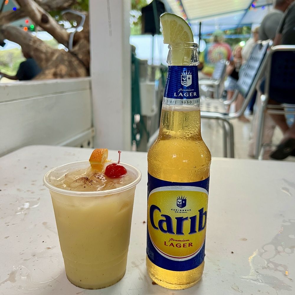 Miss Lucy's Restaurant - Virgin painkiller and Carib beer - Caribbean Near Me - St. John, Virgin Islands