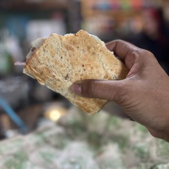 Cheba Hut Toasted Subs - a hand holding a piece of bread - Sandwiches Near Me - Denver, Colorado Cheba Hut Toasted Subs - a hand holding a piece of bread - Sandwiches Near Me - Denver, Colorado