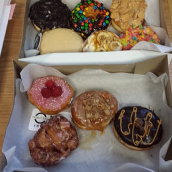 Donut Bar + Coffee - (top, l to r) Oreo, M&M, Cinnamon Toast Crunch, Salted Caramel, Banana Walnut, Fruity Pebbles, Raspberry, Apple Strudal, PB Cup, Banana Frit - Coffee & Tea Near Me - Southfield, Michigan