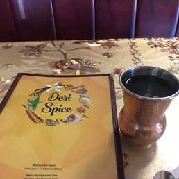 Menu and copper water cup.