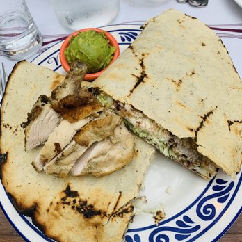 Mezcal - Tlayuda with chicken. You can also get it with steak, pork, or chorizo. Oxacan cheese + lettuce + beans puree... - Mexican Near Me - San Jose, California