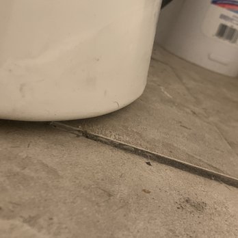 Comforts Handy Service - The reason my toilet is leaking. Tile is lifted. Poor install. - Handyman Near Me Comforts Handy Service - The reason my toilet is leaking. Tile is lifted. Poor install. - Handyman Near Me