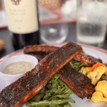 Vespa Rossa - App special: ribs from their on-site smoker; tangy and peppery - Italian Near Me - Dripping Springs, Texas Vespa Rossa - App special: ribs from their on-site smoker; tangy and peppery - Italian Near Me - Dripping Springs, Texas