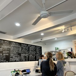 Gum Tree Cafe - Menu board and cashier. Friendly service!