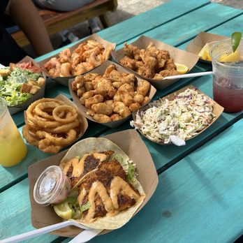 Fish Hut Grill - Caesar salad, peel eat shrimp, onion rings, cheese curds, fish bites, fish tacos, and slaw. blueberry jalapeño margarita & orange crush. - American Near Me - Emerald Isle, North Carolina Fish Hut Grill - Caesar salad, peel eat shrimp, onion rings, cheese curds, fish bites, fish tacos, and slaw. blueberry jalapeño margarita & orange crush. - American Near Me - Emerald Isle, North Carolina