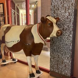 Dedrick's Main Street Cheese - June 5, 2025 - Mascot cow on wheels.