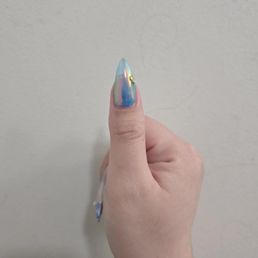 Gel-x with medium rounded stiletto shapes with designs Gel-x with medium rounded stiletto shapes with designs