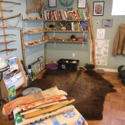 Inside the office, where the buffalo hide and books are