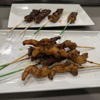 Gourmet Sate House - Beef and shrimp (front) lamb and pork belly (rear) - Indonesian Near Me - Pensacola, Florida Gourmet Sate House - Beef and shrimp (front) lamb and pork belly (rear) - Indonesian Near Me - Pensacola, Florida