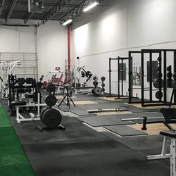 Base Kamp Gym - Squat racks, deadlift platforms, free weights, strength training machines, 80 feet of indoor turf, strongman equipment