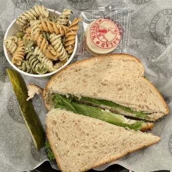 Chicken Salad Chick - Their Cranberry Kelli on signature wheat bread, with a pasta side salad. - Southern Near Me - Cary, North Carolina Chicken Salad Chick - Their Cranberry Kelli on signature wheat bread, with a pasta side salad. - Southern Near Me - Cary, North Carolina