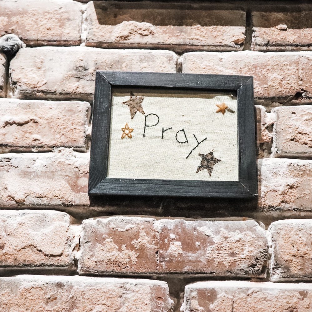 The Porter - a picture of a brick wall with a picture frame with a message that reads pray - Pubs Near Me - Hattiesburg, Mississippi The Porter - a picture of a brick wall with a picture frame with a message that reads pray - Pubs Near Me - Hattiesburg, Mississippi