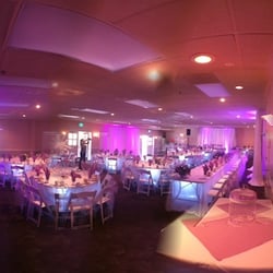 PLM Productions - Up lighting, drape, under table lighting centerpieces and monogram by PLM Productions