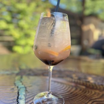 Redwood Cafe - a drink in a glass on a table - New American Near Me - Modesto, California