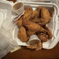 7 Entertainers Cafe & Lounge - 10 wings with honey lemon pepper sauce on the side.