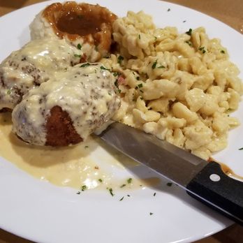 Das Schnitzel Haus - Veal Schnitzel stuffed with ham and cheese. Side of spaetzle and mashed potatoes.  Covered in a cheese and bacon sauce - German Near Me - Parma, Ohio