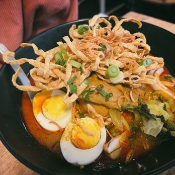Chomp Chomp Thai kitchen - Khao Soi - northern Thai style egg noodles in curry broth - Thai Near Me - New York, New York