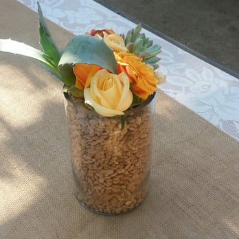 Veridian Deserts - a vase of flowers on a table - Landscaping Near Me Veridian Deserts - a vase of flowers on a table - Landscaping Near Me