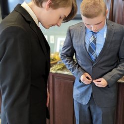 Milano Tailor - Older cousin helping the younger one.