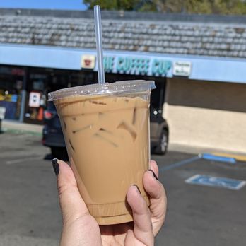 The Coffee Cup - a hand holding a cup of iced coffee - Coffee & Tea Near Me - San Jose, California