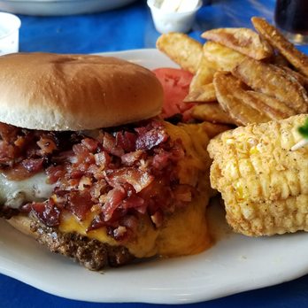 Blind Tiger - The blind tiger burger with Cajun fried corn on the cobb. - Cajun/Creole Near Me - Shreveport, Louisiana