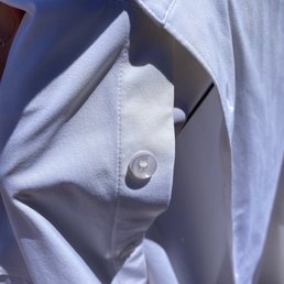 Fabric that has been discolored due to their dry cleaning mistake. Shirt was brand new