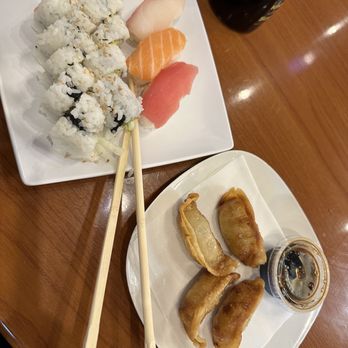 Mr Sushi Express - a plate of sushi and chopsticks - Japanese Near Me - Orlando, Florida