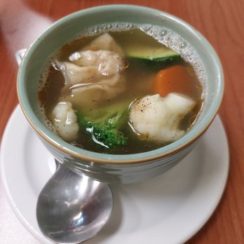 Ton Sushi - a bowl of soup on a plate - Pan Asian Near Me - Montreal, Quebec Ton Sushi - a bowl of soup on a plate - Pan Asian Near Me - Montreal, Quebec