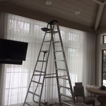 Del Greco Designs - White Ripplefold drapery goes wall to wall and ceiling to floor, even around a TV mount- light and bright! - Shades & Blinds Near Me - Deerfield, Illinois Del Greco Designs - White Ripplefold drapery goes wall to wall and ceiling to floor, even around a TV mount- light and bright! - Shades & Blinds Near Me - Deerfield, Illinois